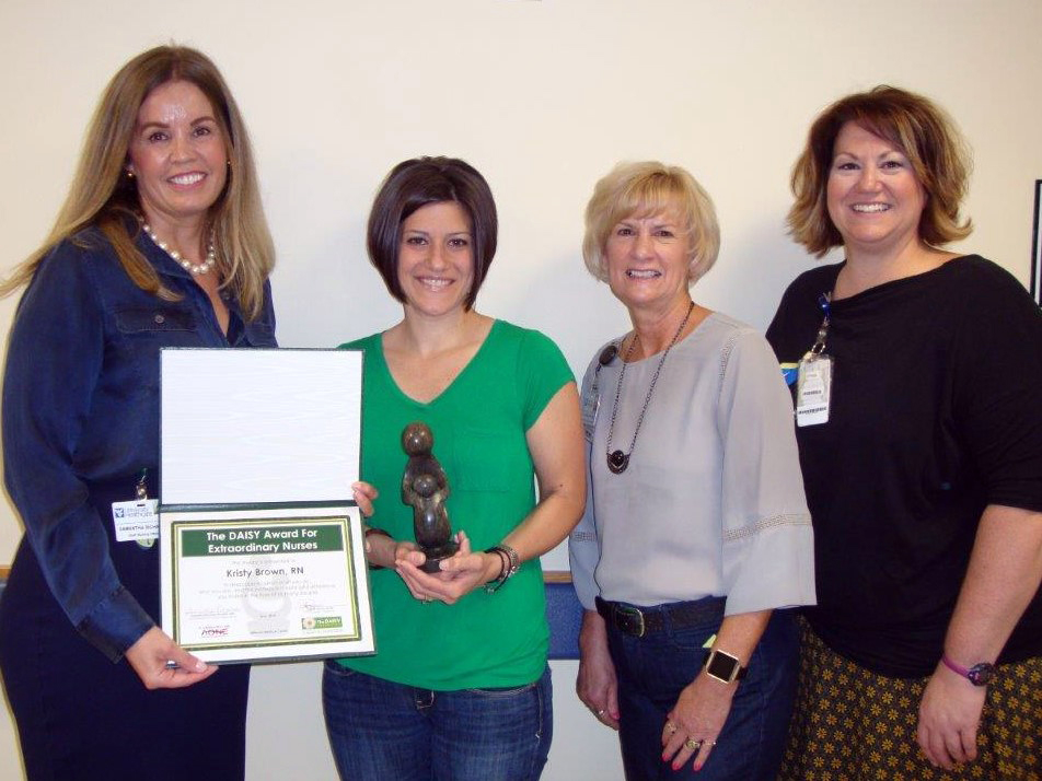WVU Medicine Jefferson Medical Center recently named Kristy Brown the DAISY Award For Extraordinary Nurses winner for 2018. She is pictured receiving her award from hospital nursing officials. (Left to right) Samantha Richards, Brown, Linda Blanc, and Jay Sine.